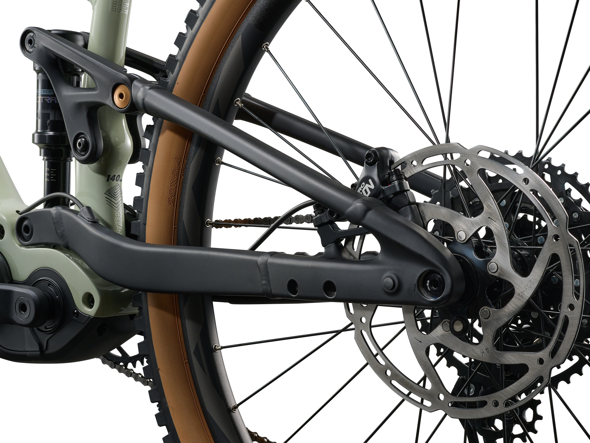 Giant Stance E+ 2 E‑MTB in Desert Sage mit Hinterbau und Bremsscheibe in Detailansicht.