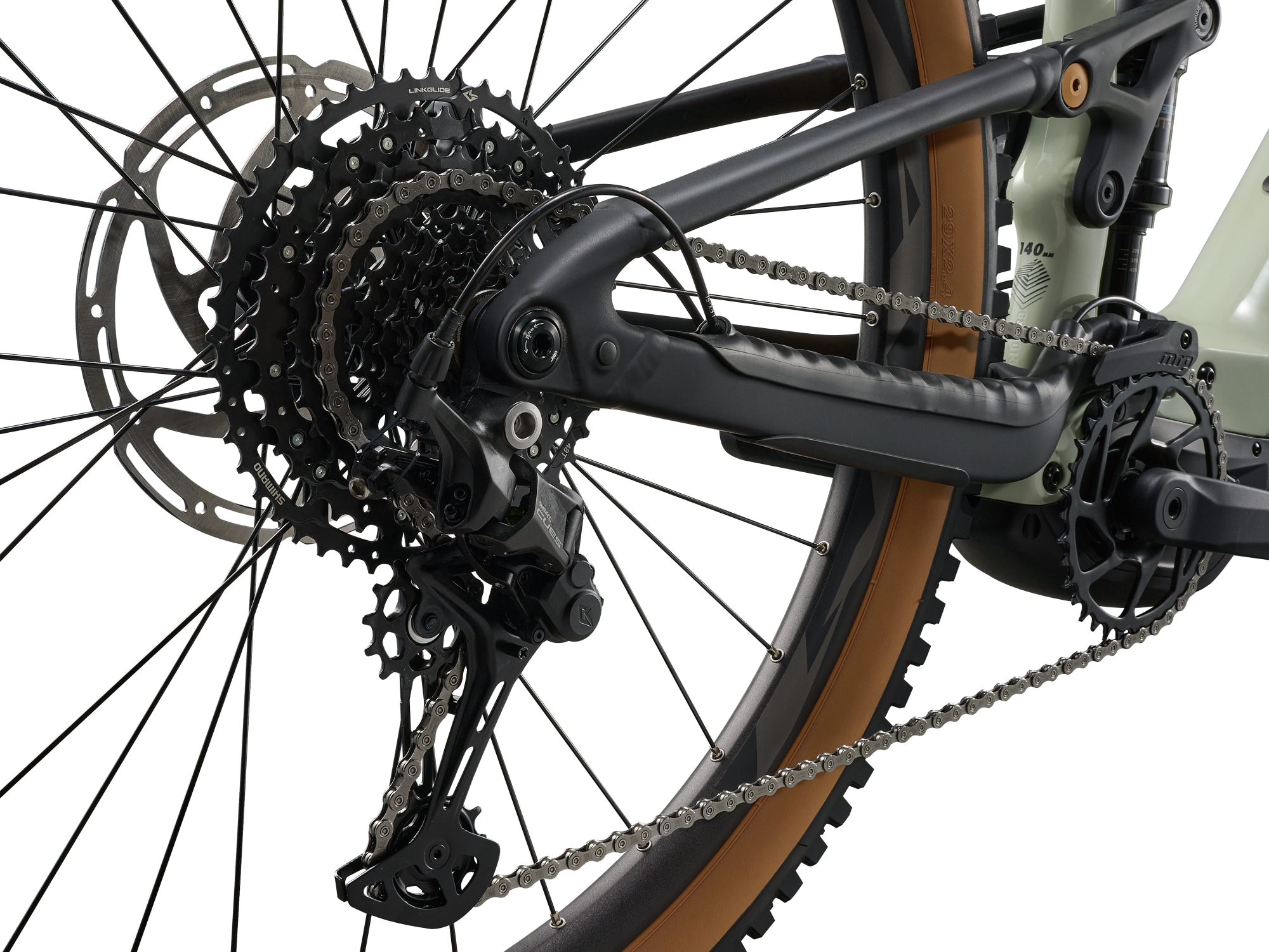 Giant Stance E+ 2 E‑MTB in Desert Sage mit Kassette, Schaltwerk und Kettenbereich.